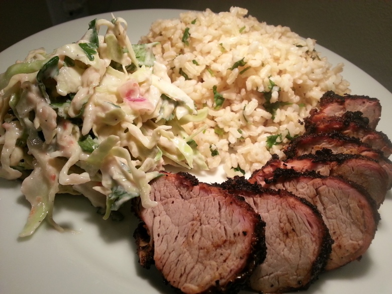 A nice, simple grilled pork alongside a gererous portion of rice and slaw