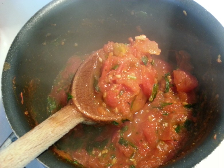 The reduced sauce, with the herbs and tomatoes mixed in