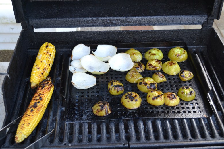 Grilling the onions, tomatillos, and some corn for a Jicama and grilled corn topping for the fish tacos