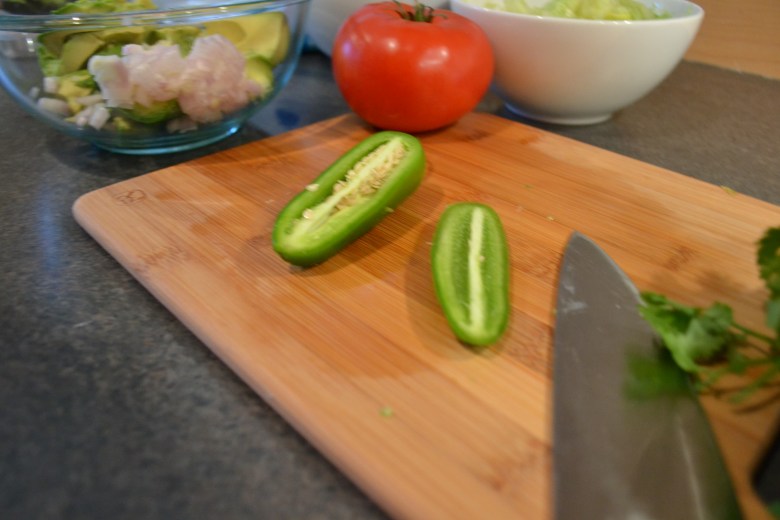I like to split the peppers and remove the seeds with a spoon