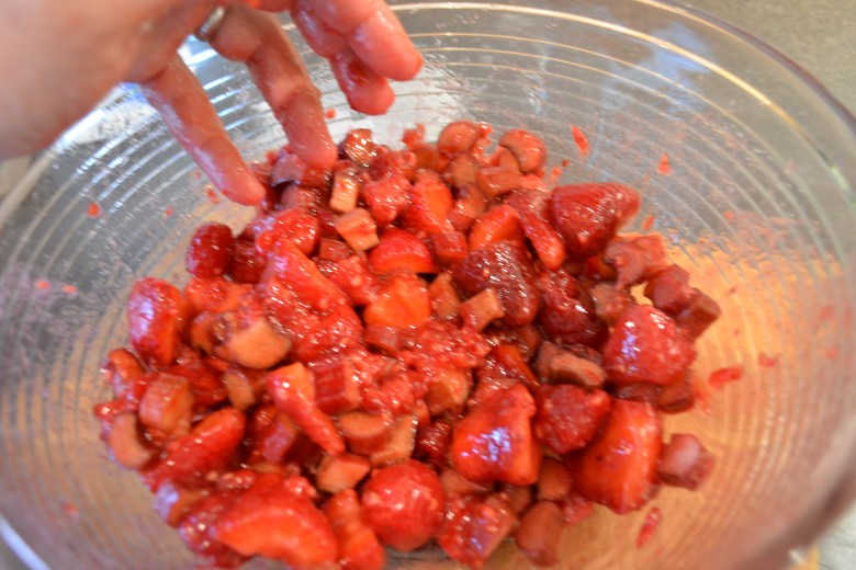Mixing the fruit, rhubarb and sugar