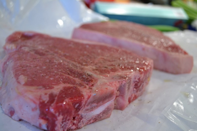 Prepping the steaks - just a touch of seasoning