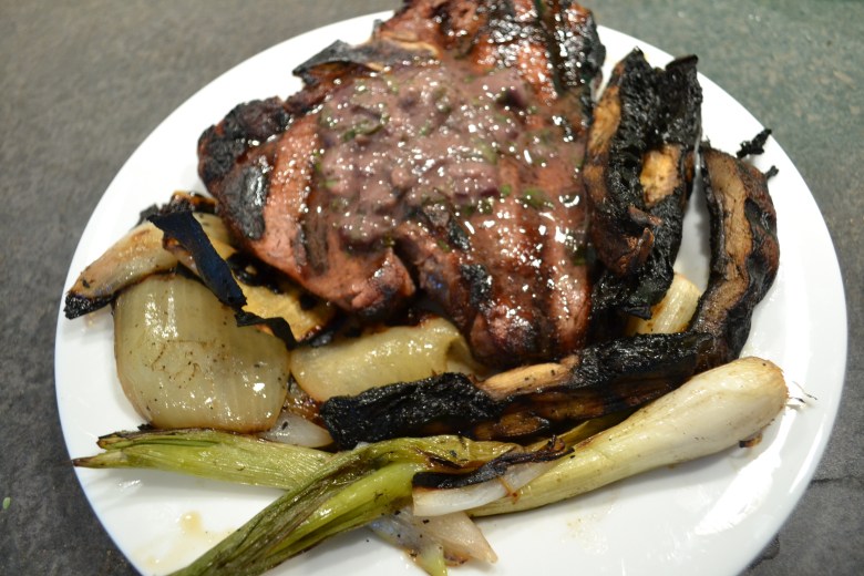 Grilled t-bone with wine-herb butter and grilled veggies